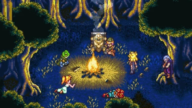 Characters sitting around the campfire in Chrono Trigger