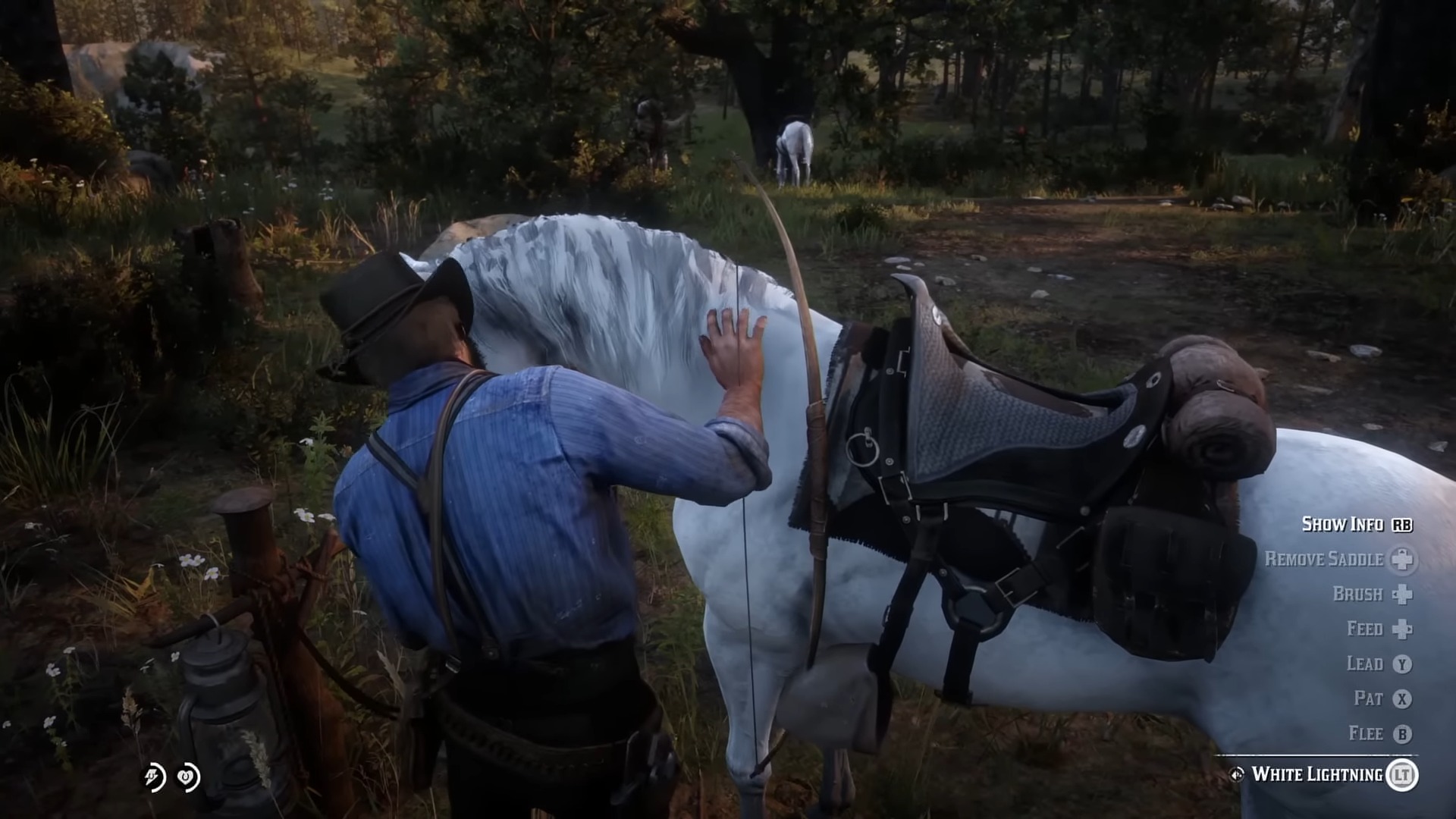 A cowboy petting a horse in Red Dead Redemption 2.