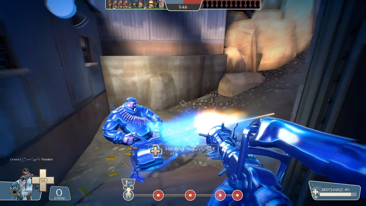 An example of a Medic healing a teammate in Team Fortress 2.