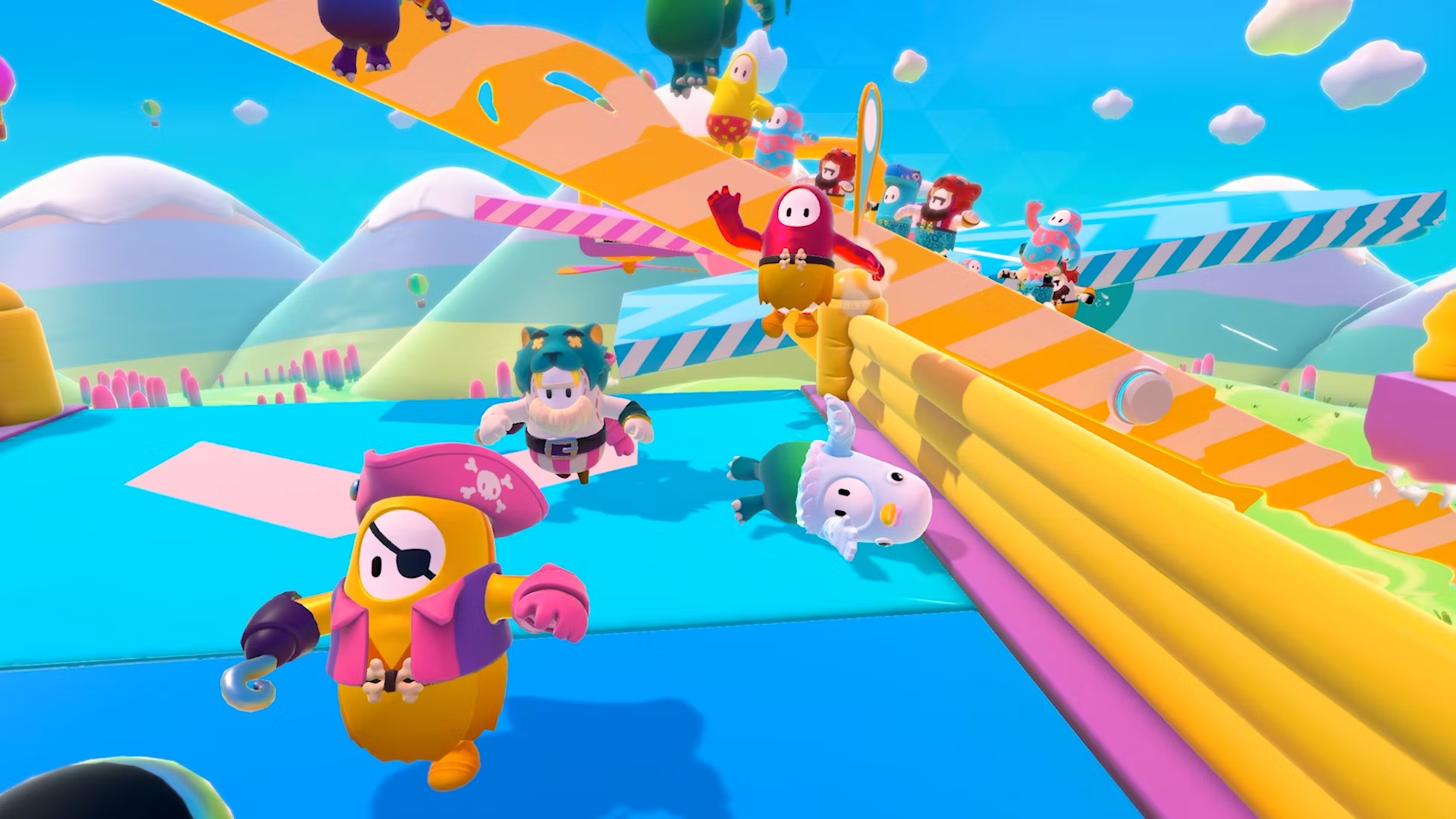 Various characters running toward the camera and stumbling in Fall Guys.